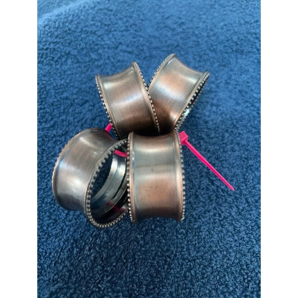 Set of 4 Copper Tone Napkin Rings with Decorative Edge